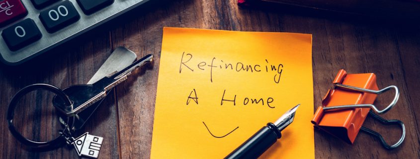 A post-it note with the text Refinancing a home, and a smile.