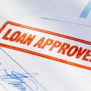 Image of "loan approved" stamp on paperwork