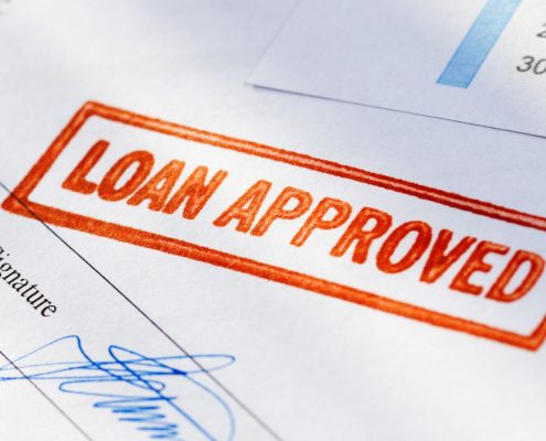 Image of "loan approved" stamp on paperwork