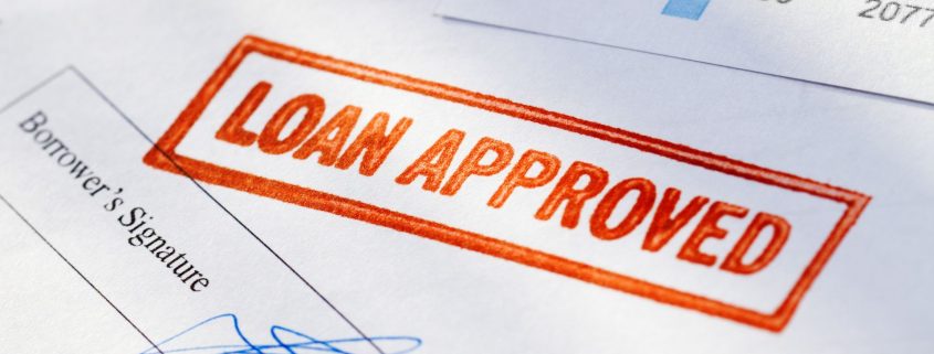 Image of "loan approved" stamp on paperwork