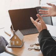 Image of the hands of people negotiating a property deal