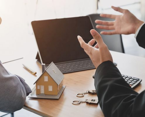 Image of the hands of people negotiating a property deal