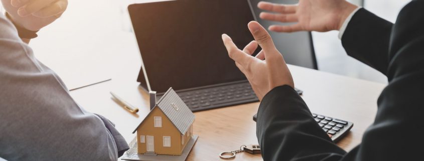 Image of the hands of people negotiating a property deal