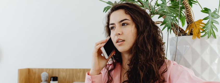 Woman on the phone to Indigo Finance to conduct a mortgage review