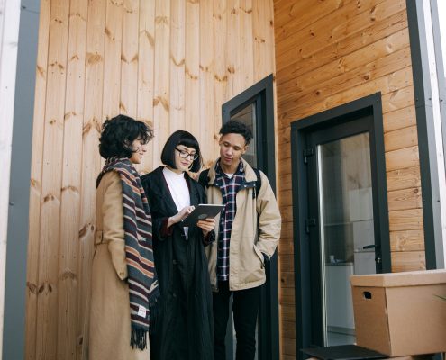 Friends looking at properties together