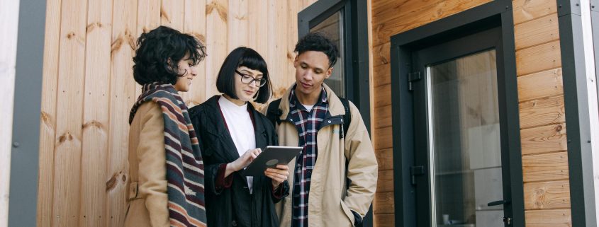 Friends looking at properties together